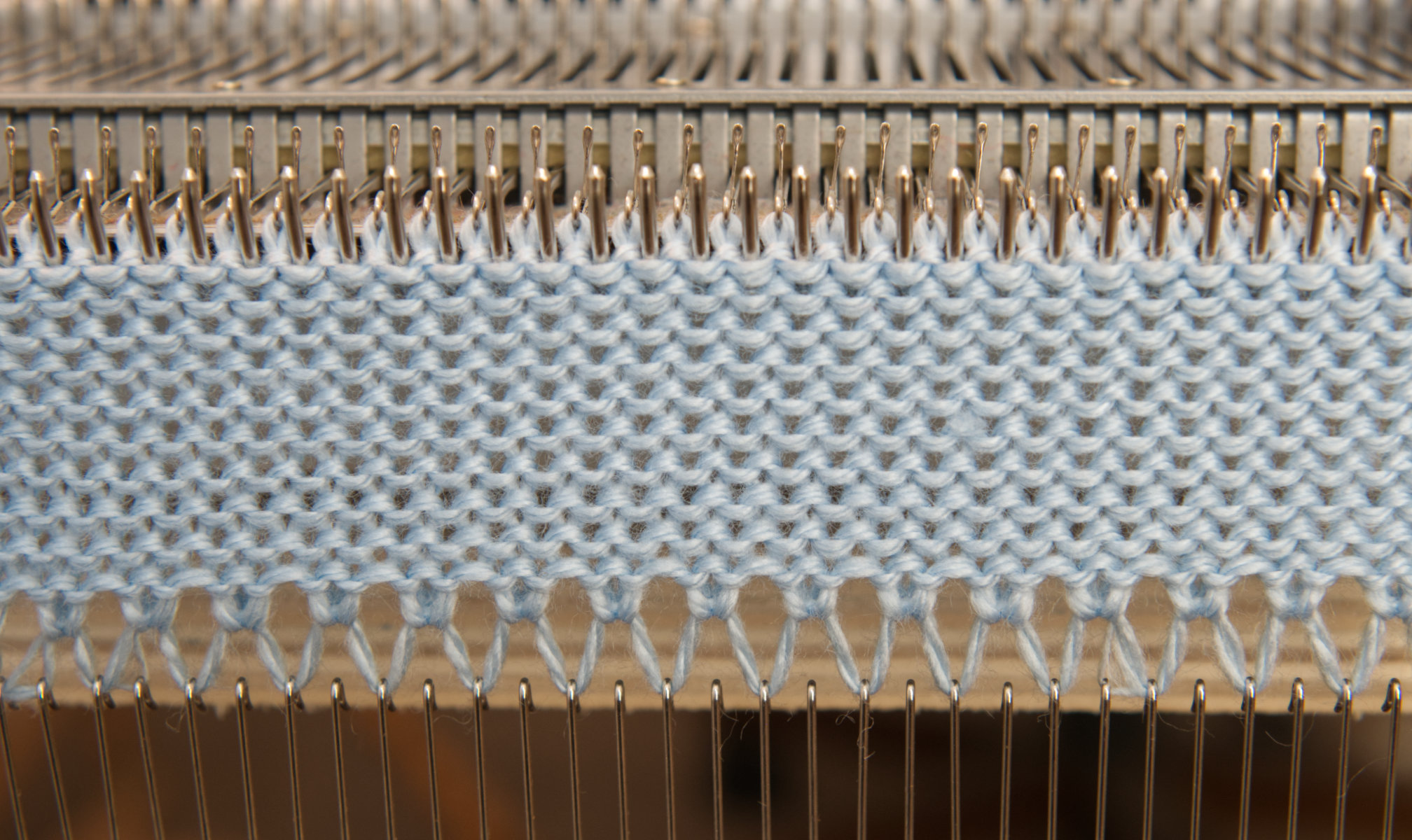 Image: open cast on in a flatbed knitting machine