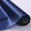 Silk charmeuse fabric on the bolt, navy blue